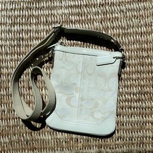 White Coach print cross body bag.
